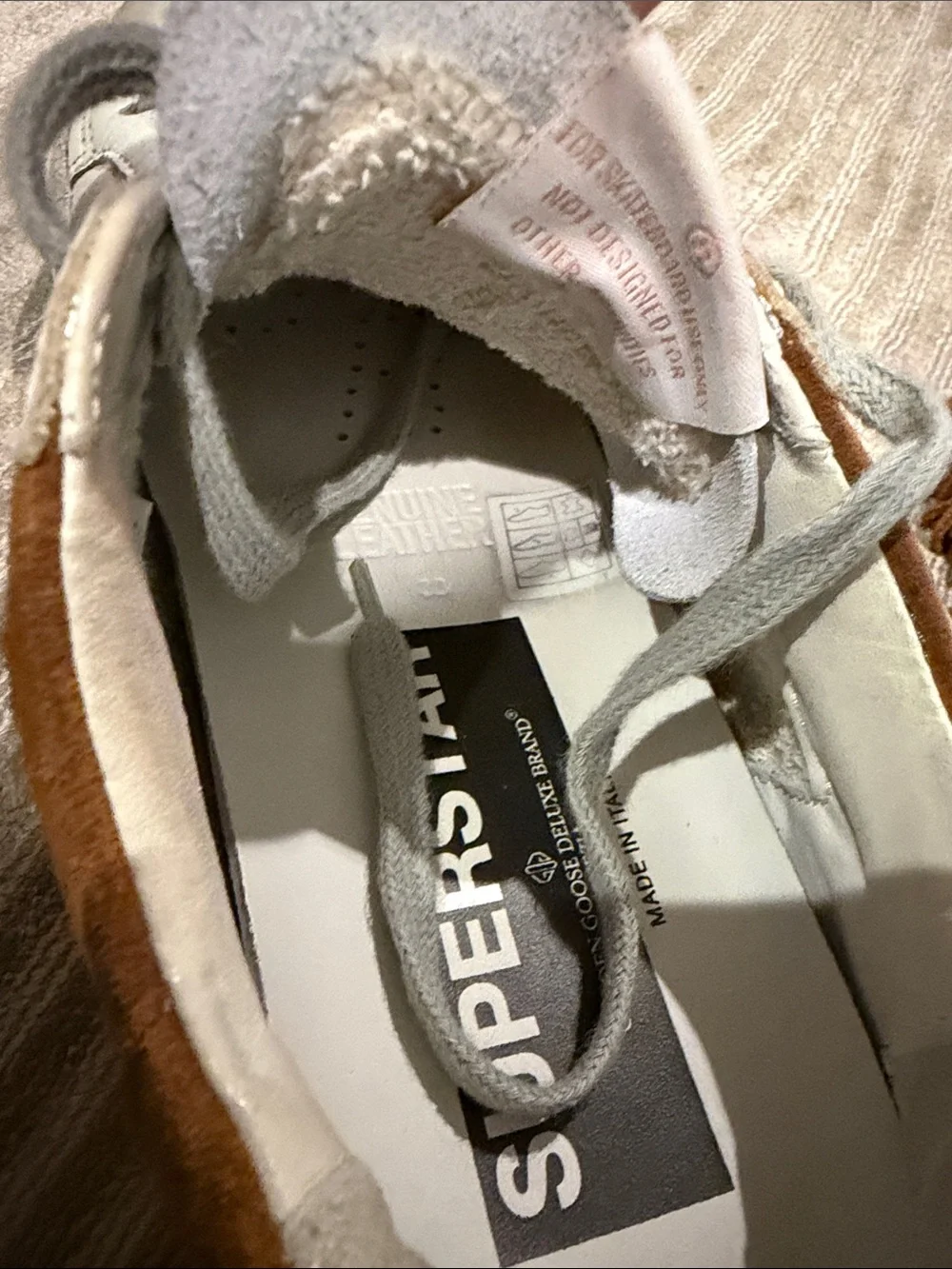 Golden Goose Women’s White Nubuck Low Top Super Star with Brown suede fringe.